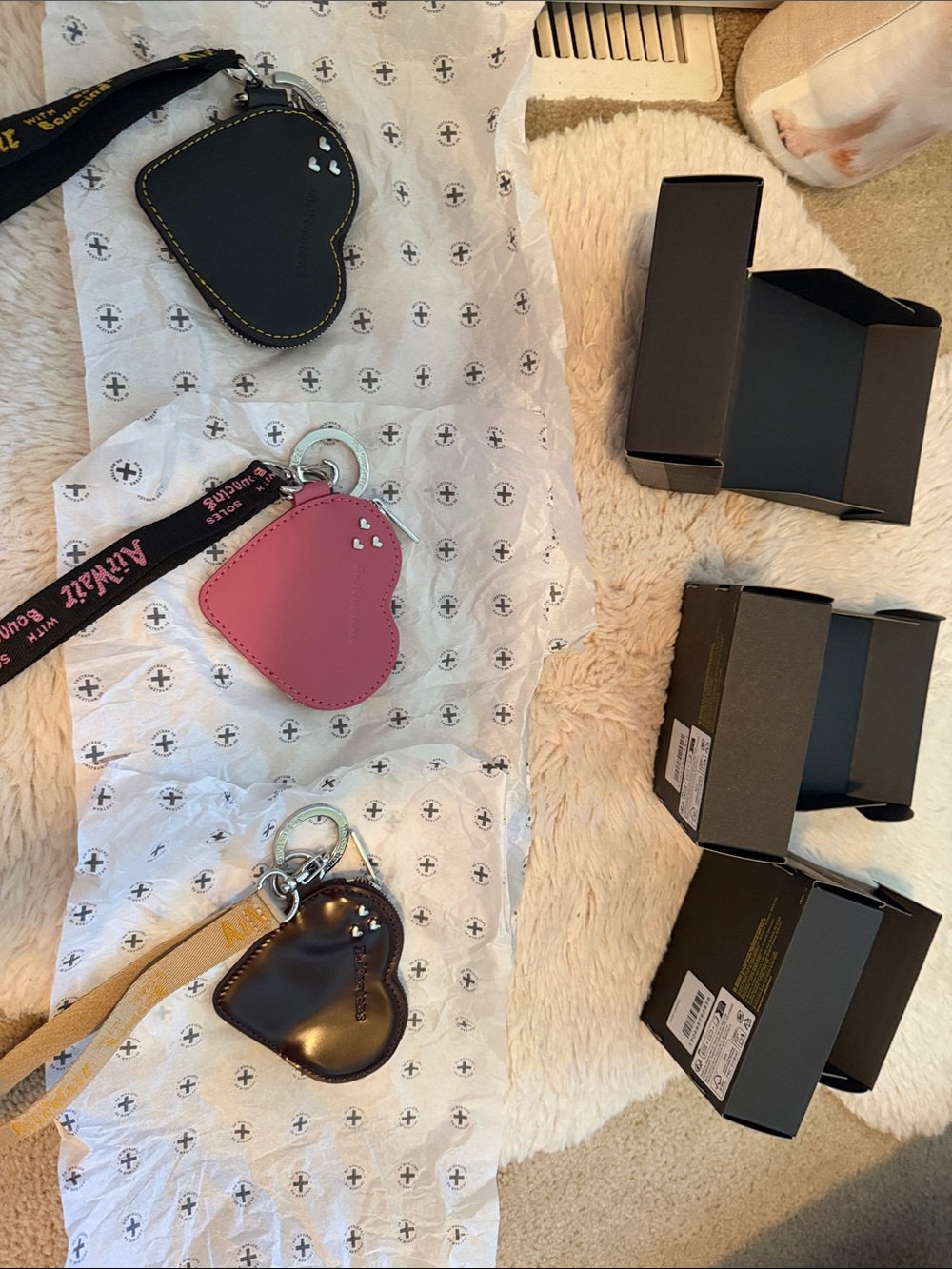 Three Dr. Martens Heart Key & Card Holders in Black, Pink, Oxblood.